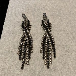Silver Tone with Black and Rhinestone settings Very nice. Dangle